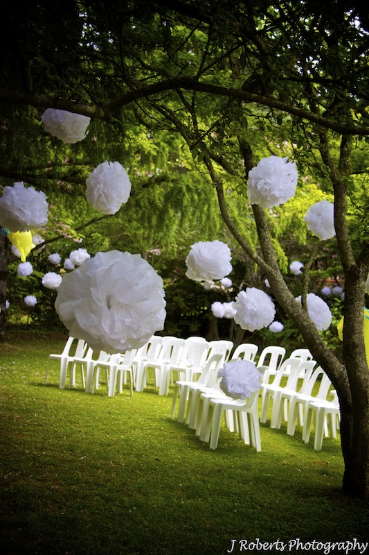Floating pompom decorations garden wedding - wedding photography